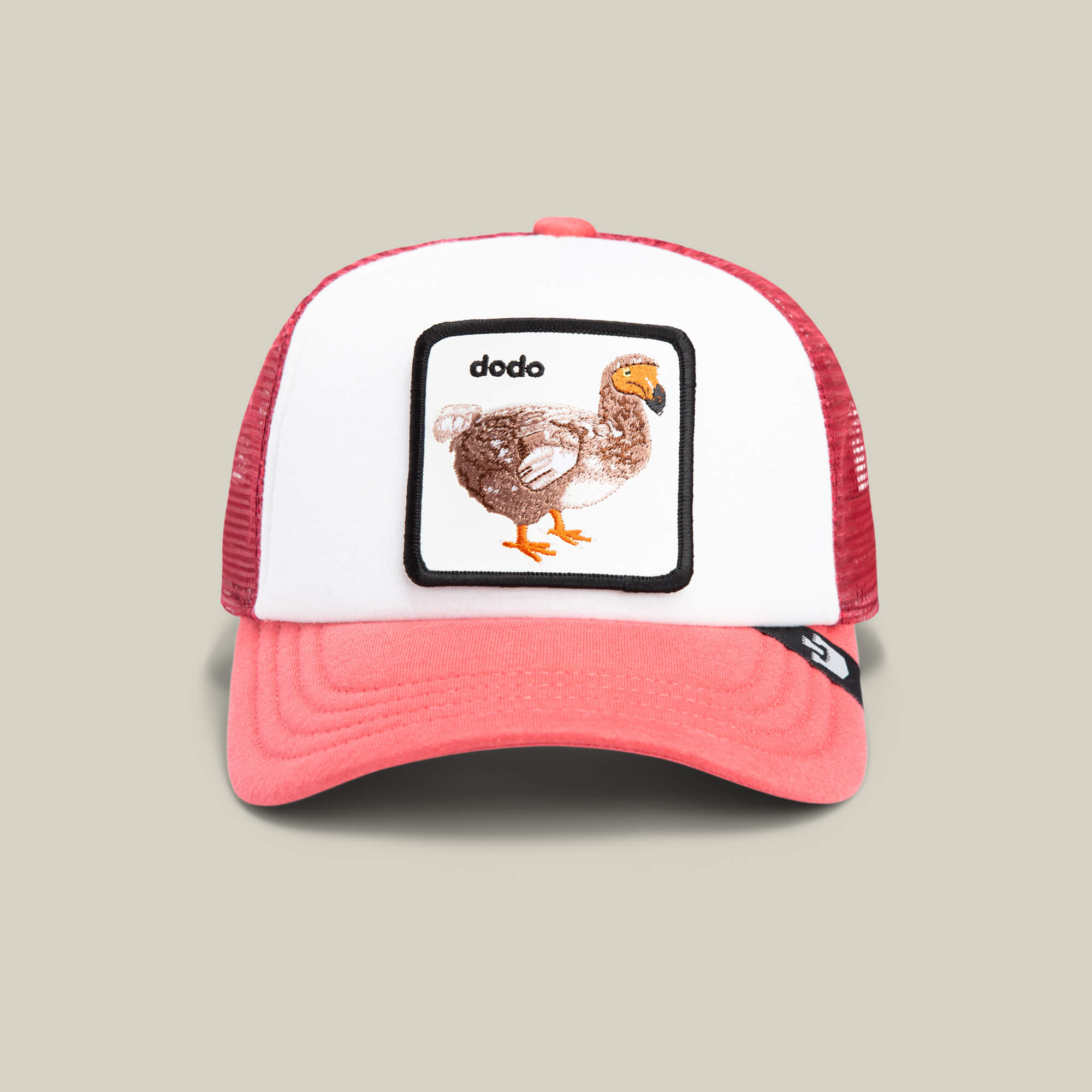 The Goorin Bros. Dodo Kiddo is a red and white trucker hat with an embroidered patch showing a dodo bird illustration and the word "dodo" above it.