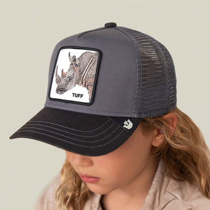 A child wearing The Tuff Rhino Mini mesh back baseball cap by Goorin Bros., featuring a rhino patch labeled TUFF on the charcoal crown.