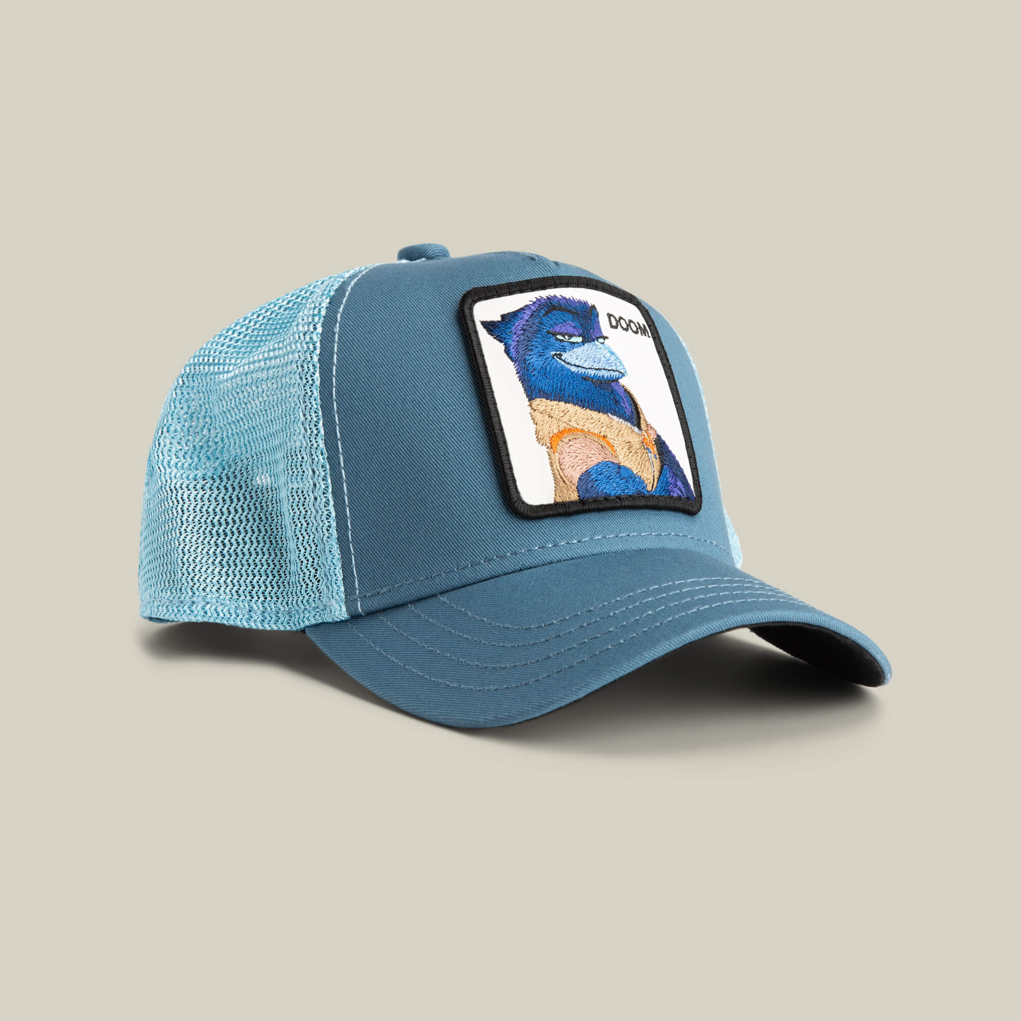 The BG2 - Doom (KIDS) by Goorin Bros. is a light blue mesh baseball cap featuring a front patch with an embroidered blue bird in a yellow shirt and the text DOGH—a fun look for young aviators.