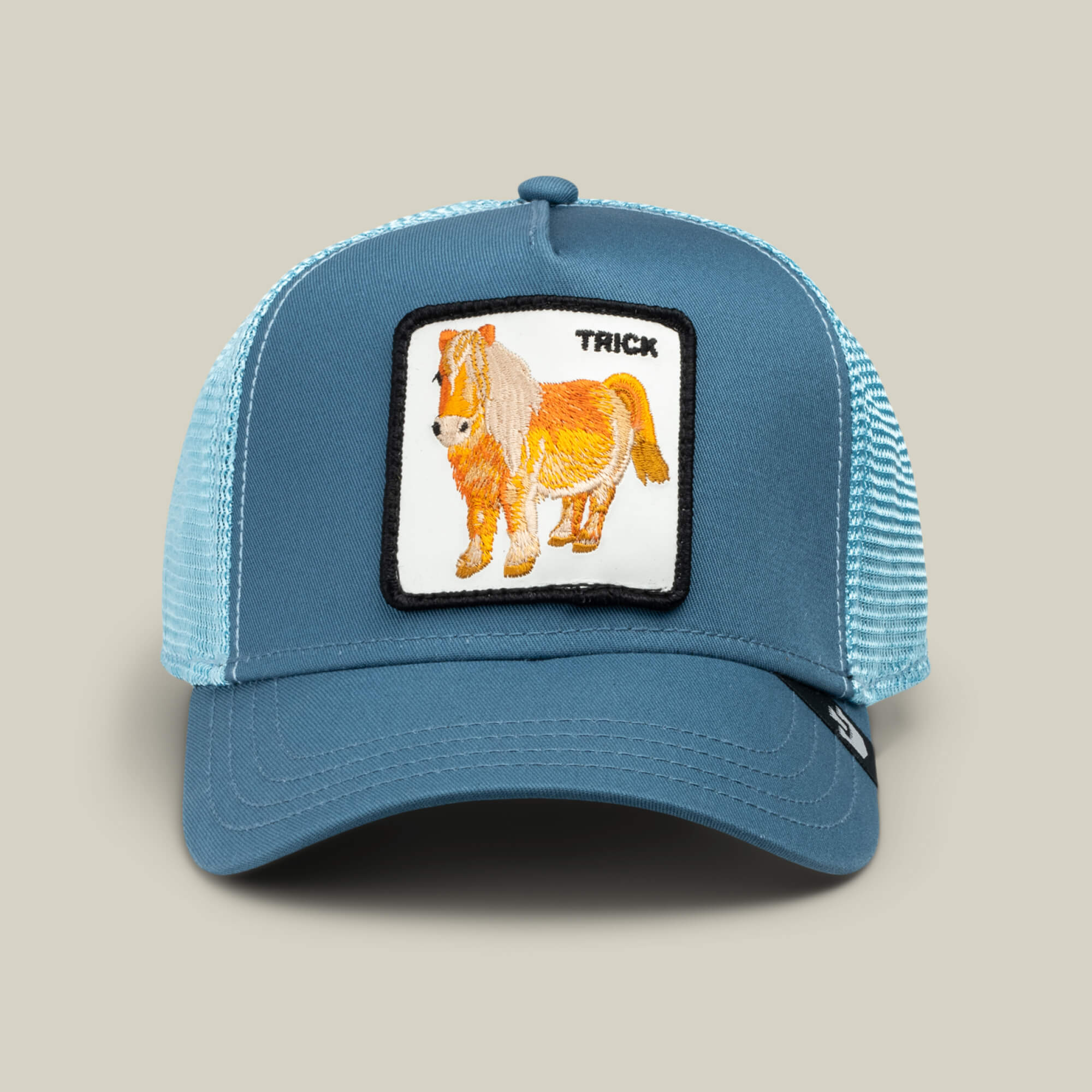 The Goorin Bros. "Dad and Pony Show" blue mesh trucker hat features a patch with an embroidered small horse and the word TRICK. This limited edition cap is great for matching dad-kid looks or as a unique Father’s Day gift.