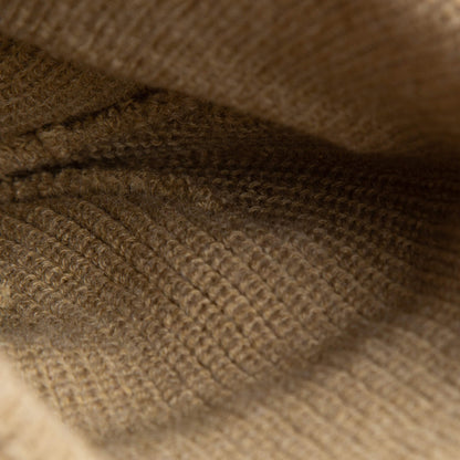 Close-up of the soft knit beige ribbed texture and stitching inside The Cuddly Beanie Mini by Goorin Bros.—perfect for a cozy kids beanie.