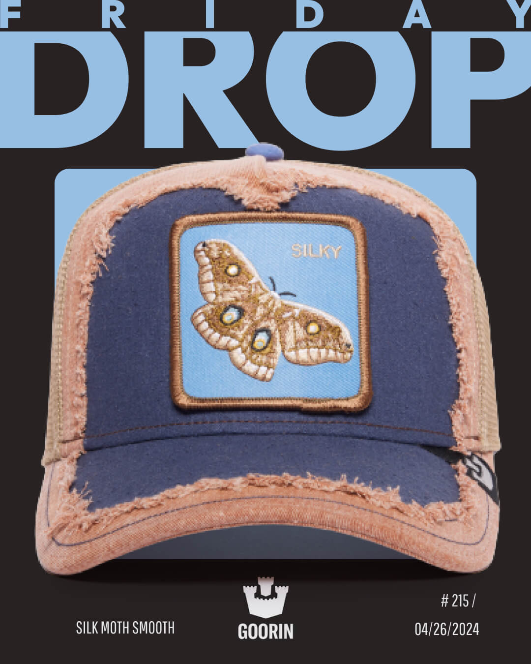 A distressed blue and tan trucker hat featuring an embroidered moth patch labeled Silky, showcasing Goorin's bold hat designs. This durable hat drops Friday, 04/26/2024.