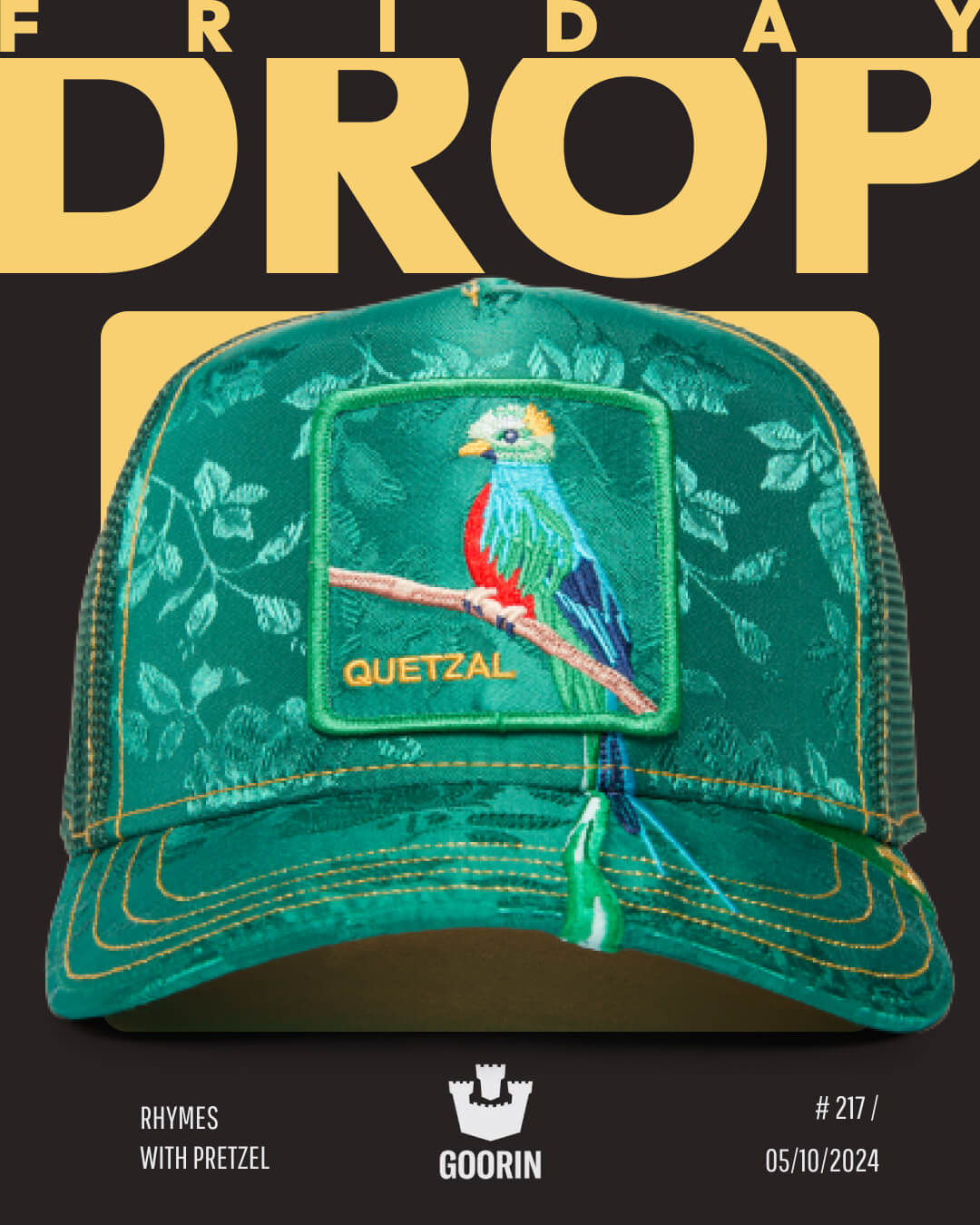 A green Goorin trucker hat featuring an embroidered quetzal bird patch is displayed against a black and yellow background with the text Friday Drop, showcasing bold hat designs.
