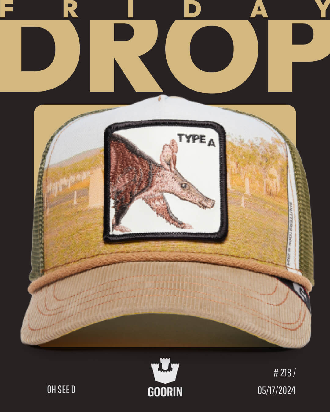 A khaki and tan trucker hat from Goorin, featuring an anteater patch labeled Type A, is displayed against a Friday Drop promotional background dated 05/17/2024—perfect for fans of durable hats and signature trucker hats.