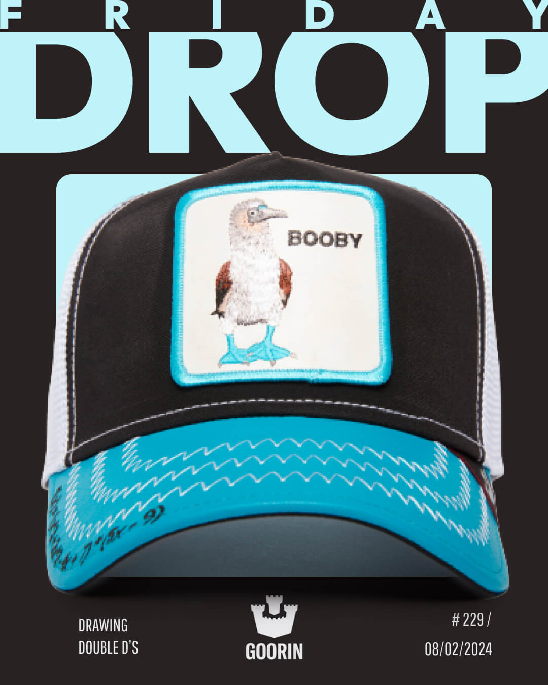 A standout among trucker hats, this cap features a blue-footed booby bird patch with "BOOBY" on the front, plus signature Goorin branding and exclusive drop release details.