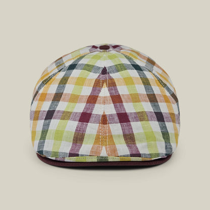 The “Point Lobos” by Goorin Bros. is a multicolored plaid 6 panel Ivy flat cap, handmade in the USA from a breathable cotton blend, displayed upright on a plain beige background.