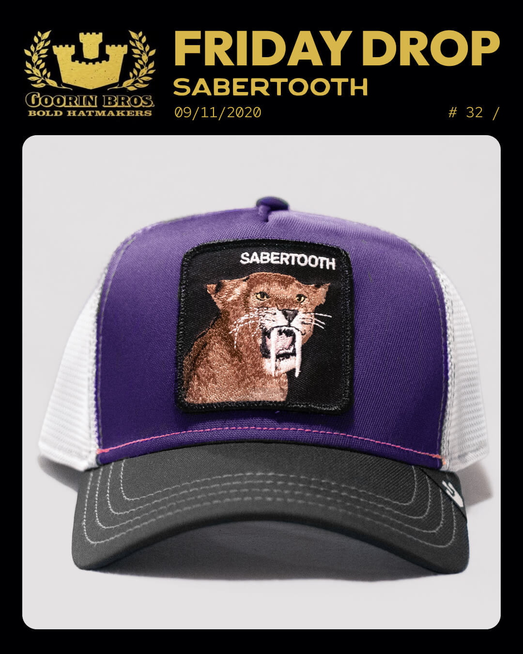 This durable, American made trucker hat features a purple and white mesh design with a patch showing a sabertooth cat and the word SABERTOOTH on the front.