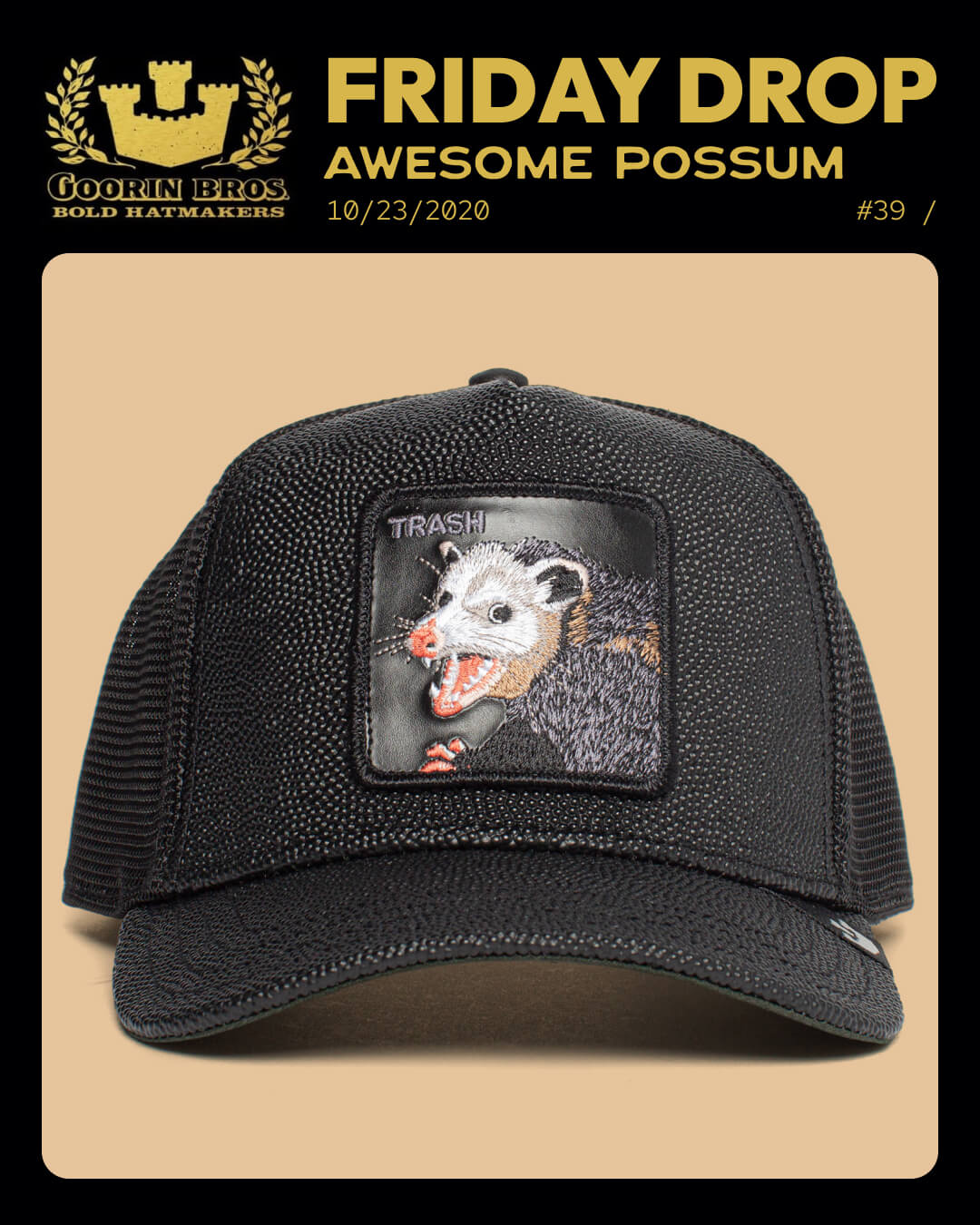 Black trucker hat with possum patch on a beige background, featuring Goorin Bros branding.