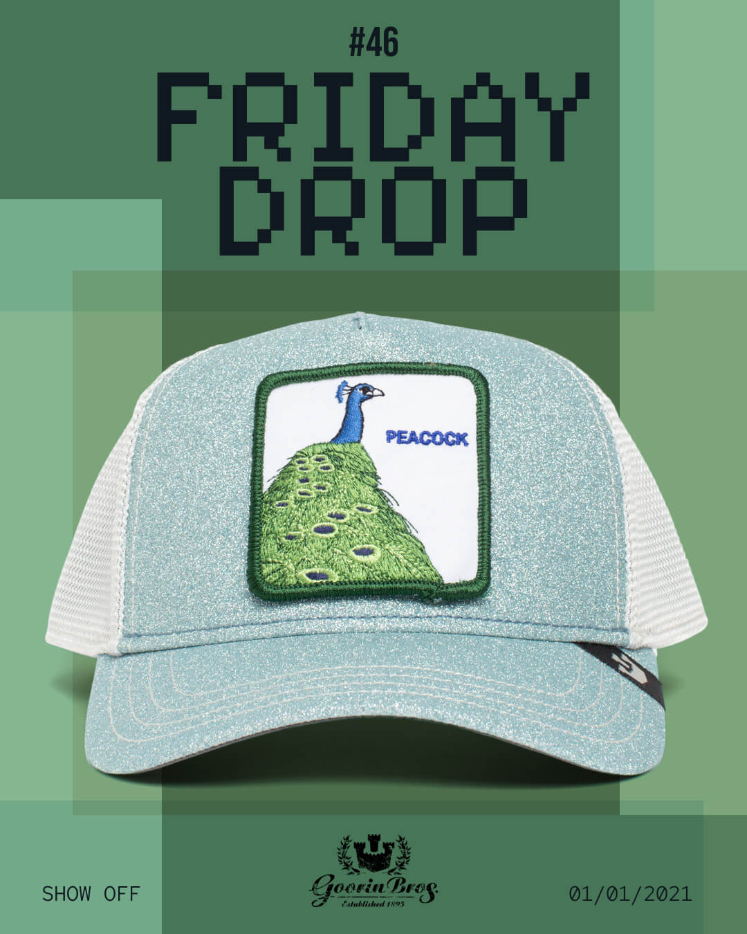 A blue and white mesh trucker cap featuring a peacock patch, showcased against a green backdrop with #46 Friday Drop and Goorin Bros Show Off 01/01/2021—highlighting bold hat designs for standout style.