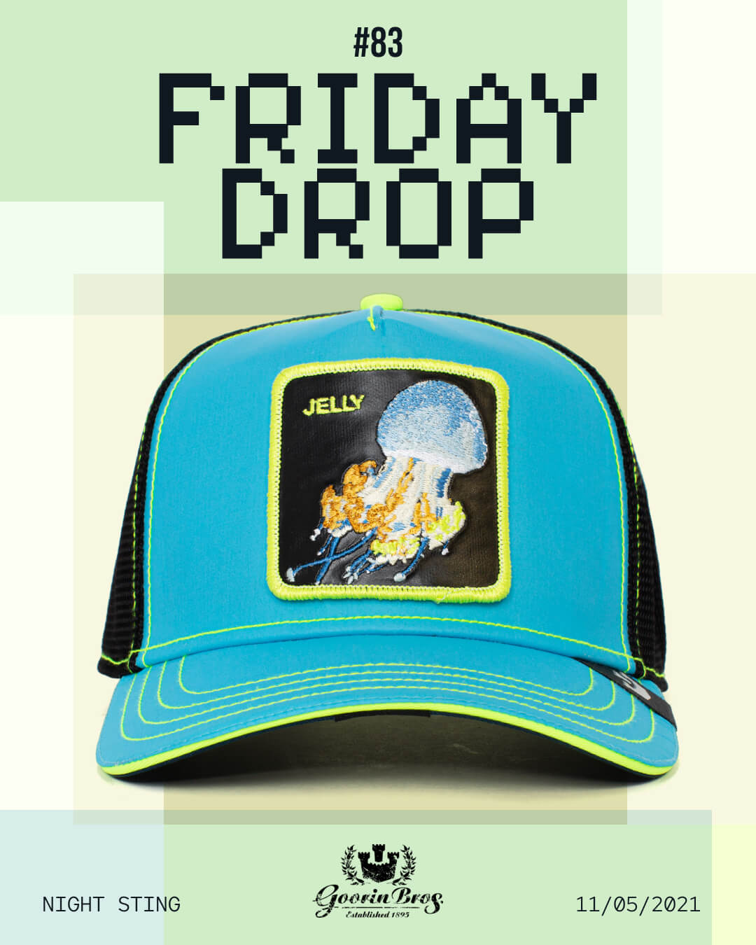 Blue and black mesh trucker hat with a jellyfish patch on the front, displayed under text reading Friday Drop #83. This American made design showcases the brand logo and date 11/05/2021 at the bottom.