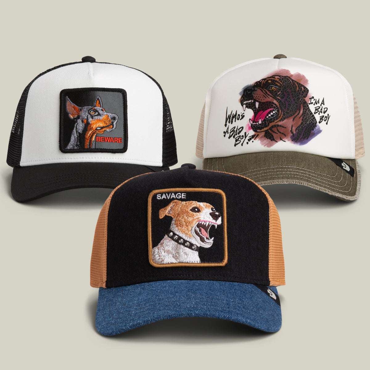 The Dawg Days of Summer Bundle by Goorin Bros. features three trucker hats with bold, embroidered aggressive dog designs and text—BEWARE, I’m a BAD BOY!, and SAVAGE—creating standout accessories that make a statement against any neutral background this summer.