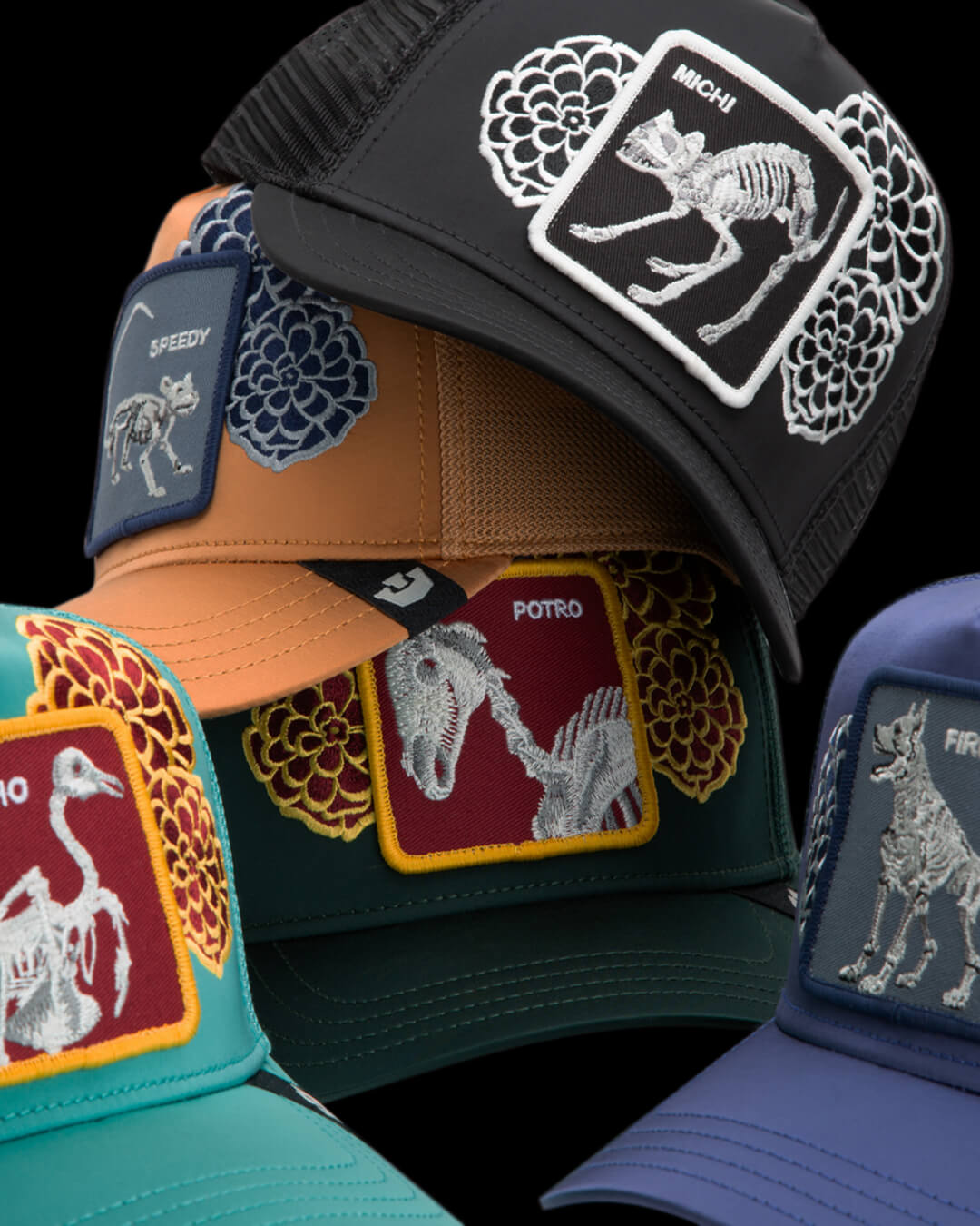 Collection of colorful caps with various patches on a black background