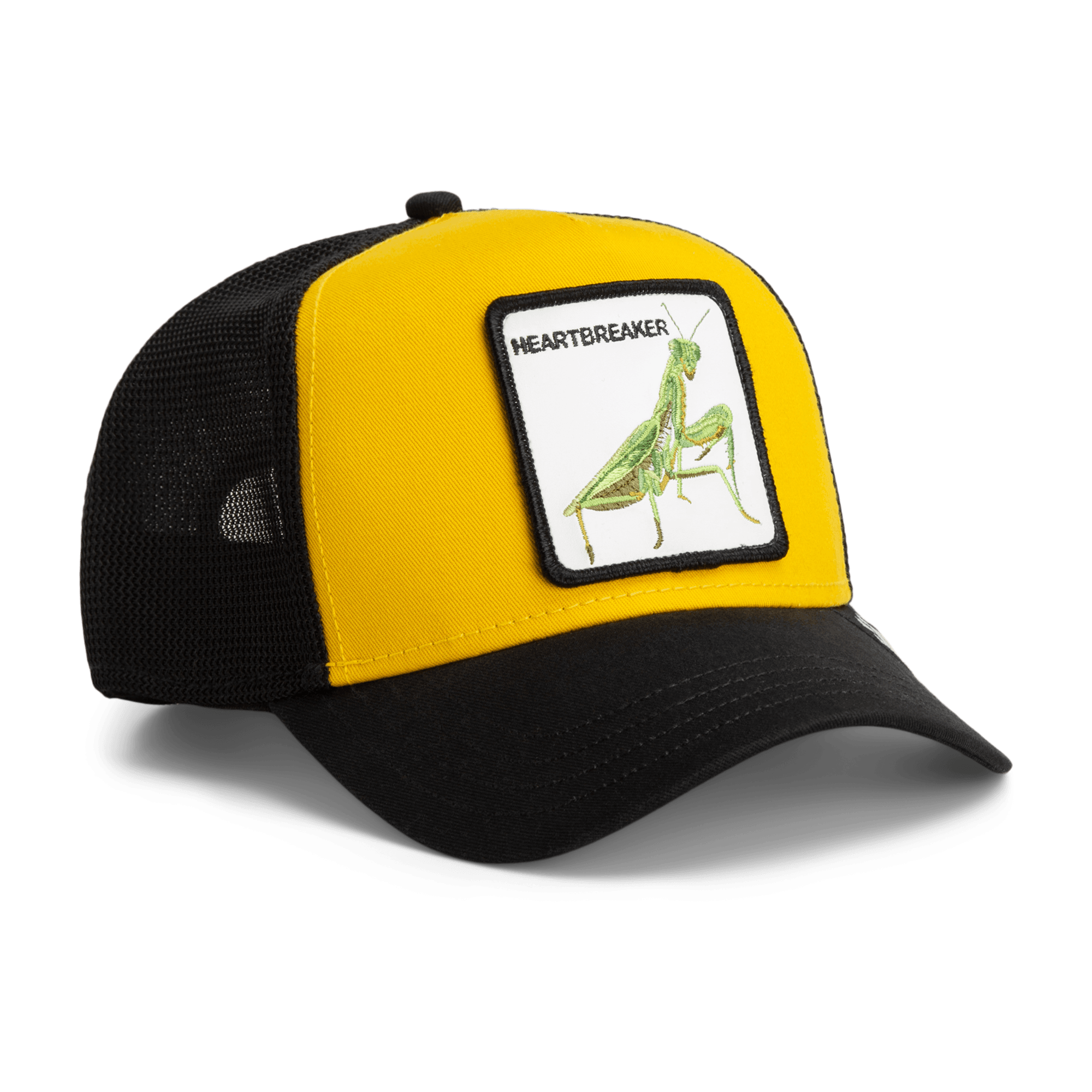 The Heartbreaker by Goorin Bros is a yellow and black trucker hat featuring a mesh back panel and an embroidered patch of a green praying mantis insect with the word Heartbreaker on the front.