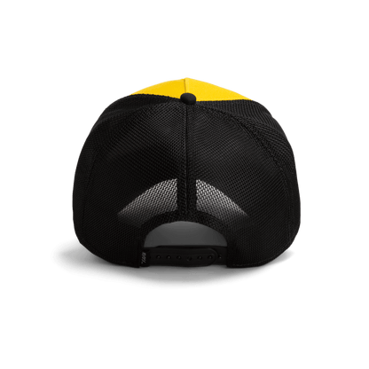 The Heartbreaker by Goorin Bros is a two-tone trucker hat featuring a yellow front panel and black mesh back with snapback closure, shown in a studio product shot.