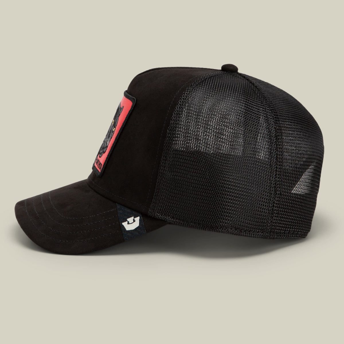 The Goorin Bros. Pantera Nera Rossa is a black mesh trucker hat with a solid black front panel, red accent patch on the side, and a small brand logo on the snapback closure, shown in a studio side profile view.