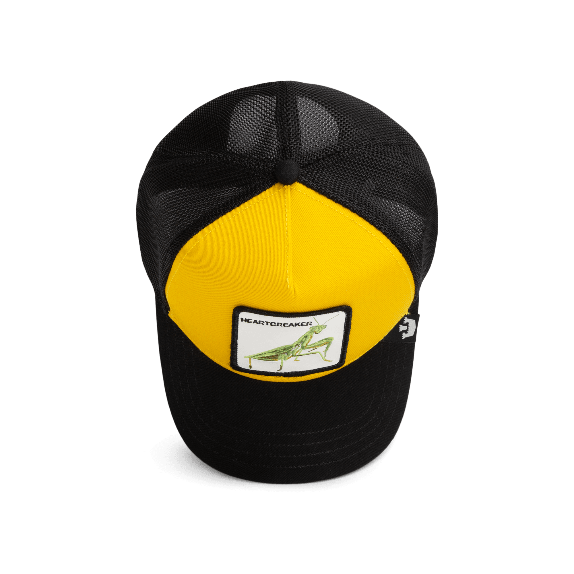The Heartbreaker by Goorin Bros is a black and yellow trucker hat with a mesh back and snapback closure, featuring a grasshopper patch on the yellow front panel, shown on a white background.